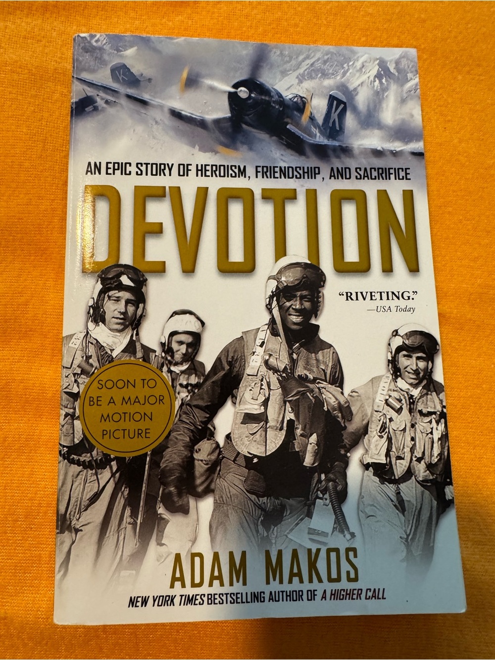 Devotion by Adam Makos — White & Gold Paperback Book